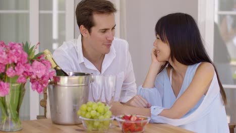 attractive mixed couple having wine together