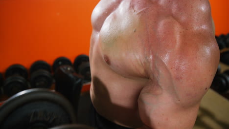 Man lifting a heavy dumbbell