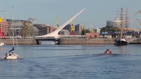 buenos aires harbor with sail boat and bridge puerto madero