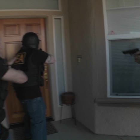 dea officers with arms drawn perform a drug raid on a house 4