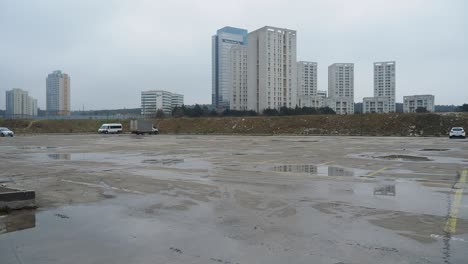 empty parking lot in a cityscape with high-rise buildings