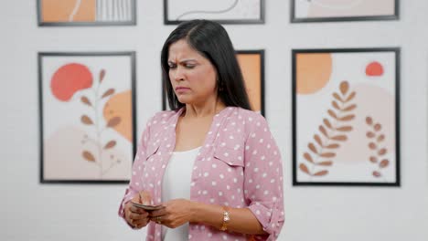 Stressed-Indian-woman-counting-money