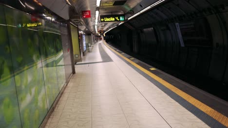 a quiet subway platform in naples, italy