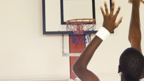 Basketball-players-playing-in-the-court