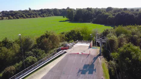 reveal-shot-of-empty-dry-ski-slope-and-lift-in-norwich,-england