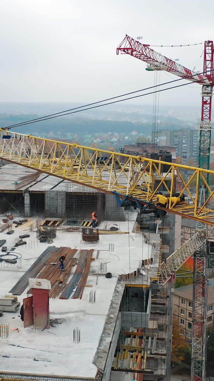Construction of a residential apartment complex. Aerial view. Vertical video