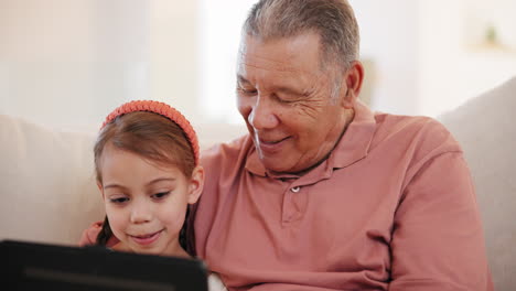 smile, tablet and grandfather with child on a sofa