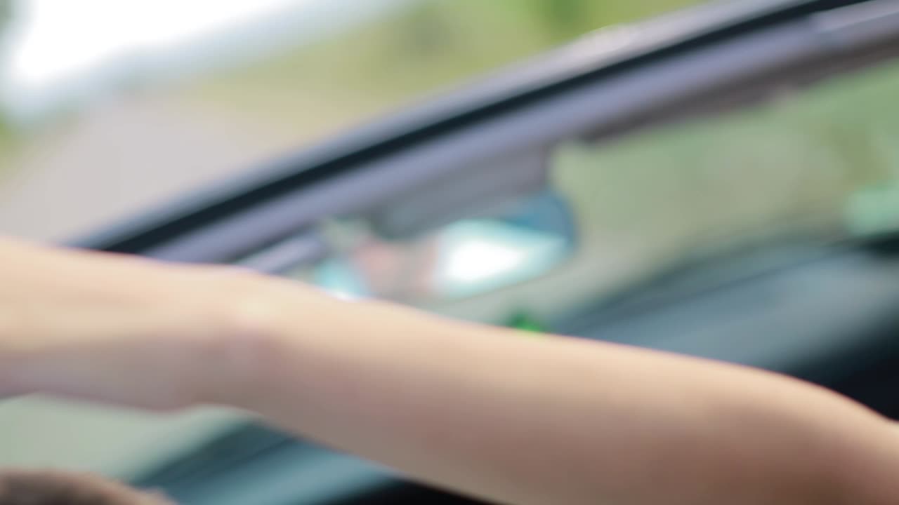 Happy Man And Woman Driving In Cabriolet Car Outdoors. Leisure, road trip, dating, couple and people concept - happy man and woman driving in cabriolet car outdoors