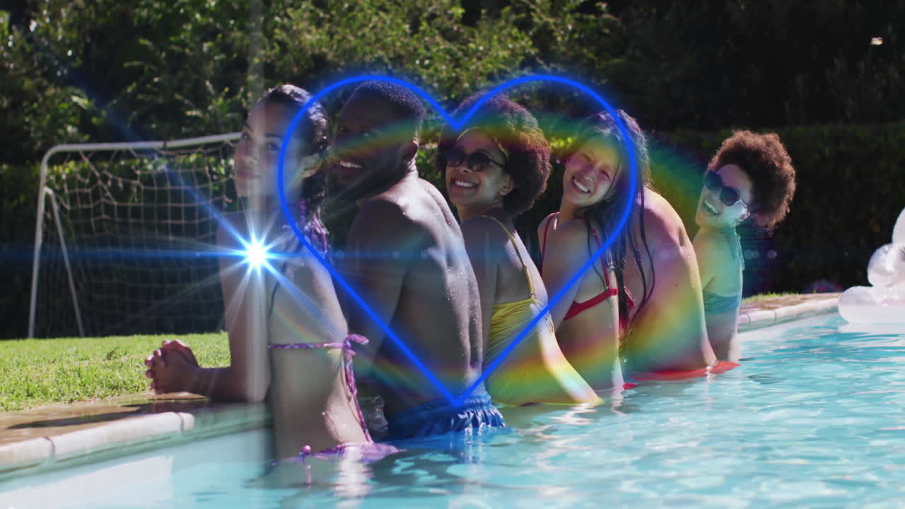 Group of friends enjoying pool with glowing heart and rainbow animation