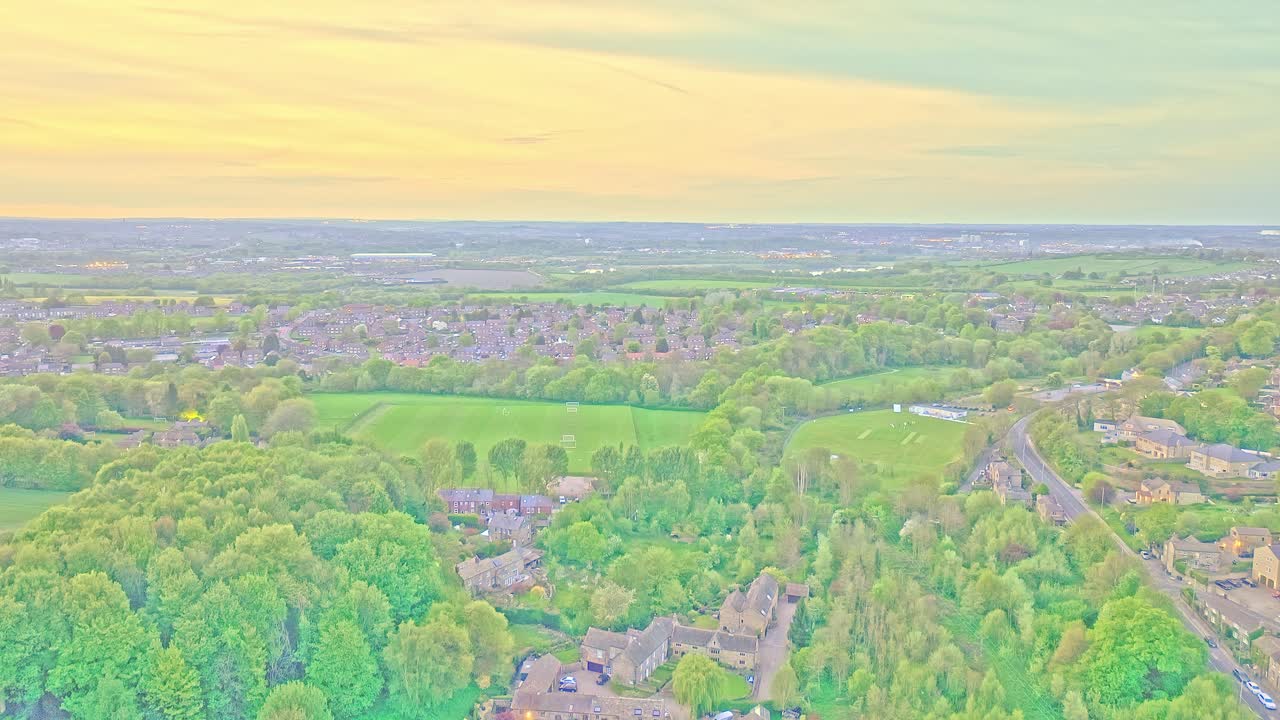 Aerial: Newmillerdam Country Park landscape during the day in Newmillerdam, suburb of Wakefield, West Yorkshire, England, crane up drone shot