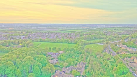 Aerial: Newmillerdam Country Park landscape during the day in Newmillerdam, suburb of Wakefield, West Yorkshire, England, crane up drone shot