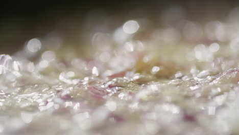 onion being sauteed in sizzling butter