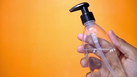 hand sanitizer bottle in hand