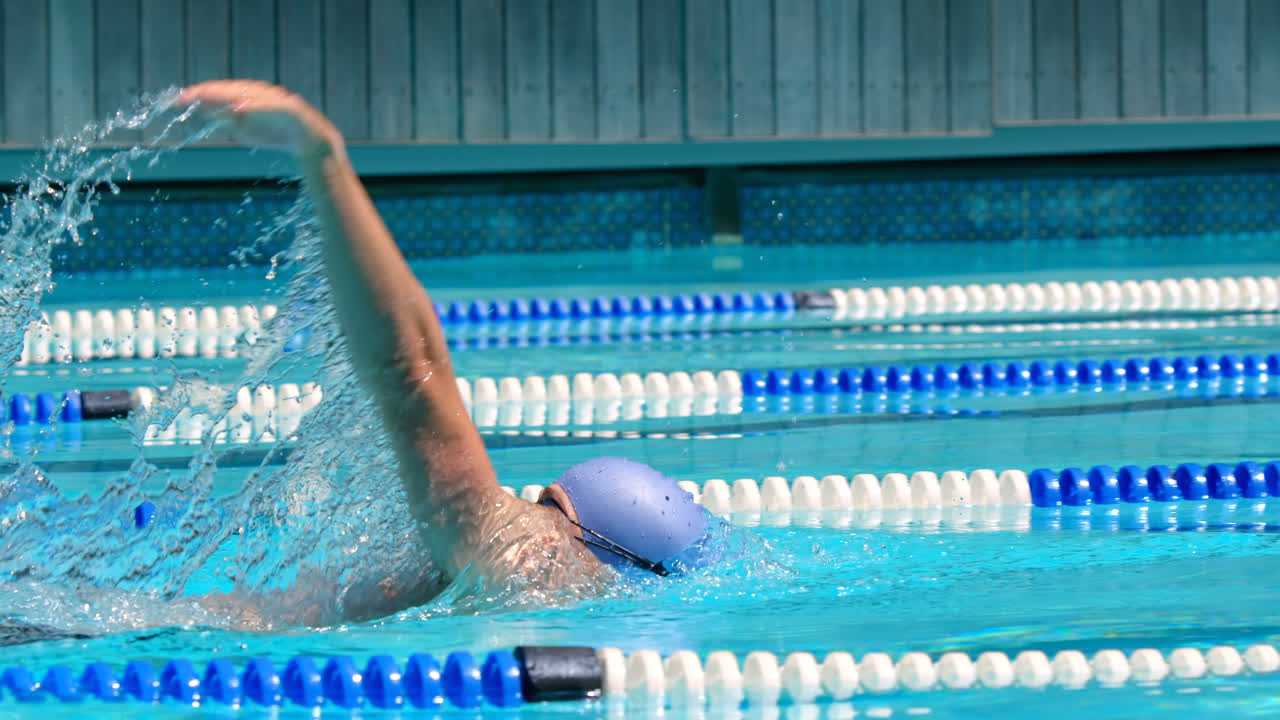 Male swimmer swimming in the  pool 4k