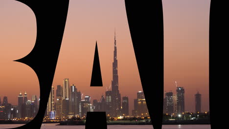 Rolling-graphic-text,-saying-Dubai,-showing-cityscape-sunset-skyline