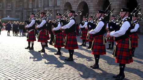 scottish bagpipe band performing outdoors