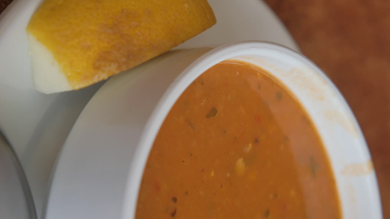 Bowl of soup with lemon