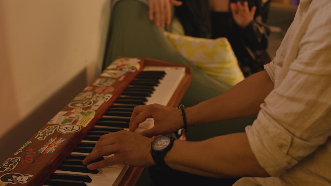 People in a room with a keyboard