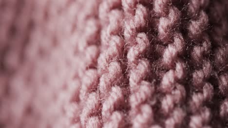 micro video of close up of pink wooly crochet fabric with copy space