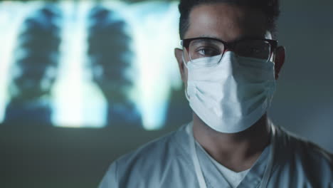 Portrait-of-Middle-Eastern-Doctor-in-Mask-in-Dark-Room