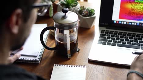 focus and creativity: a cozy workspace with coffee, notebooks, and technology for inspiration and productivity