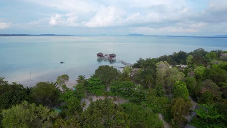 Leebong-Island-with-green-trees-and-a-resort-in-the-middle-of-the-sea-in-Belitung-Indonesia