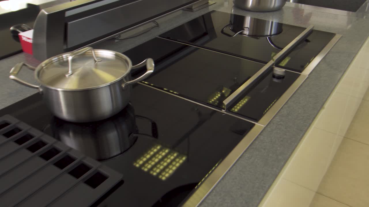 Commercial Kitchen Cooktop with Pots and Pans
