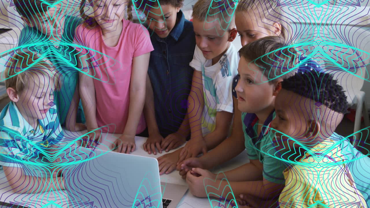 In school, children gathered around laptop with colorful animation overlaying scene