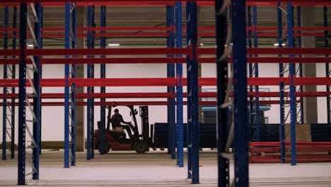 big and modern warehouse under construction, featuring metal shelving and other industrial equipment.