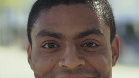 brown eyes of cheerful african american man.