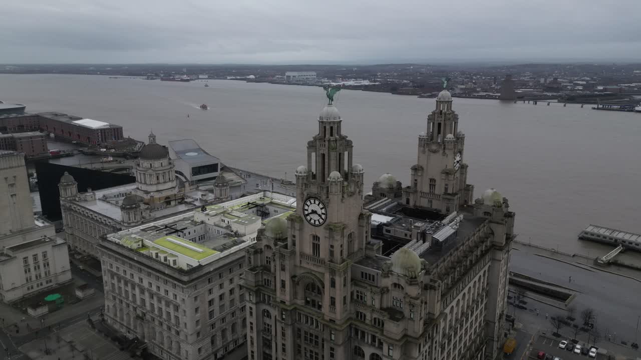 Iconic view of the Royal Liver Building with Liverpool city in the background. The historic waterfront landmark stands prominently ,showcasing its architectural grandeur against the urban skyline