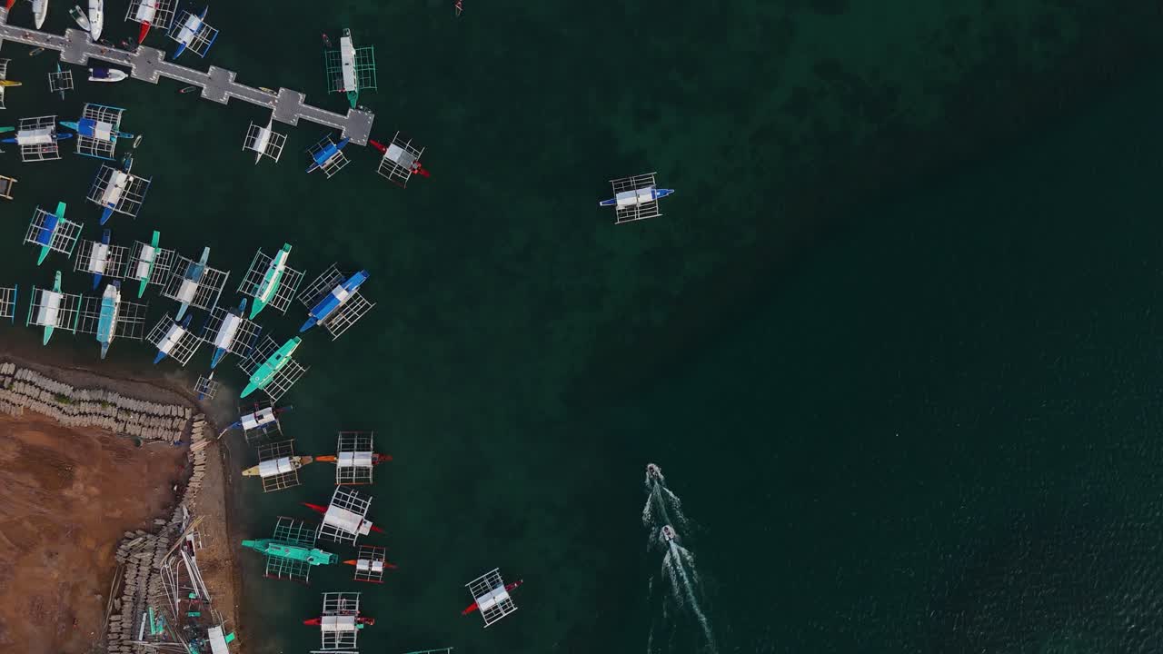 Aerial View of Boats and Pier in a Tropical Bay