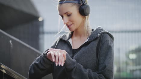 Tilt-up-video-of-running-woman-in-the-city