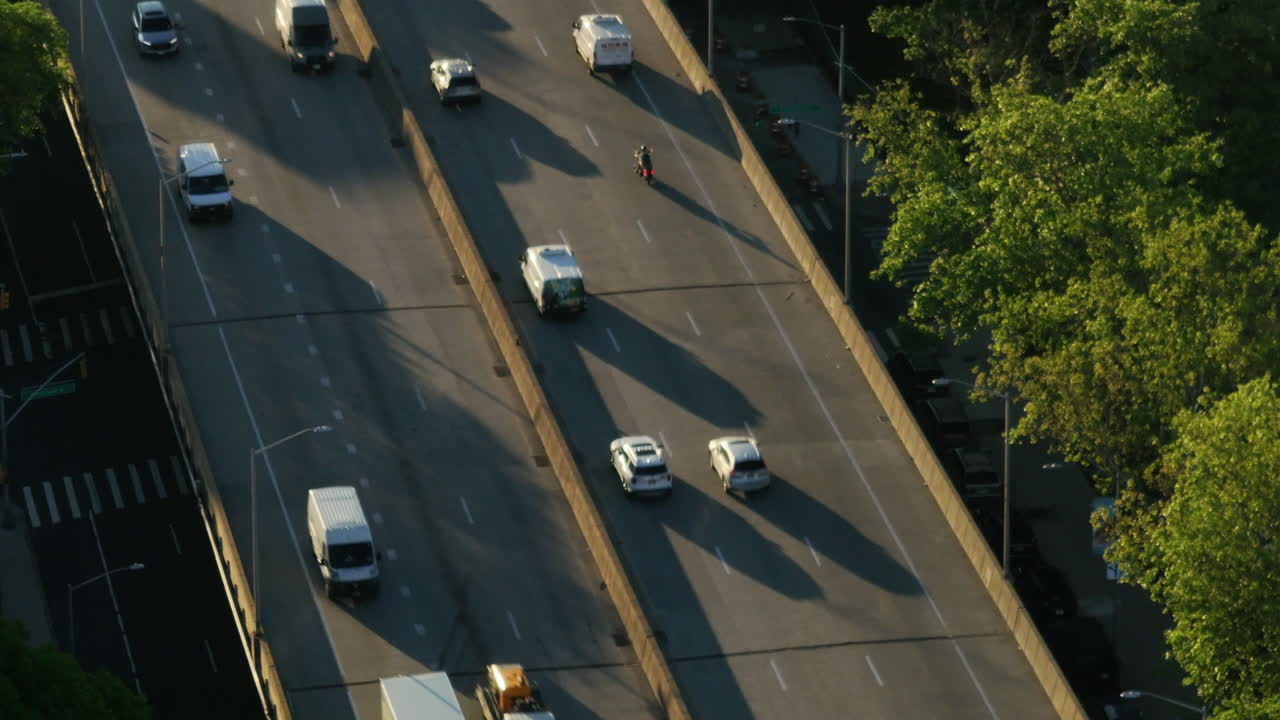 Aerial view of the Brooklyn Queens Expressway at sunrise. Shot in New York City during the morning rush hour.