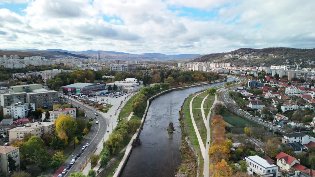 Aerial view of a river through a city skyline, showcasing urban landscape