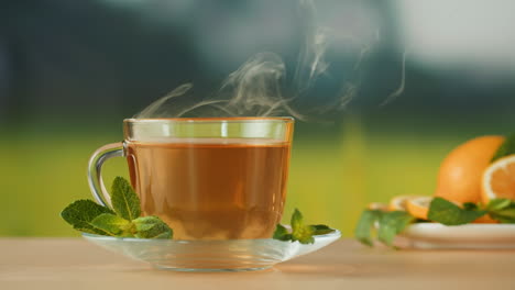 hot tea with mint and orange slices