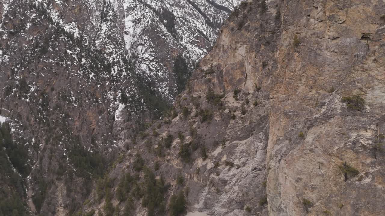 Majestic Aerial View of Snow-Capped Mountains and Rugged Cliffs in British Columbia, Canada