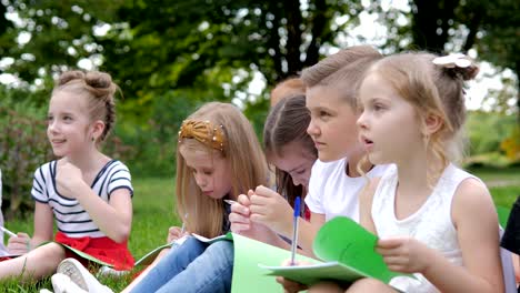 group of cheerful children learning outdoors at school after quarantine lockdown