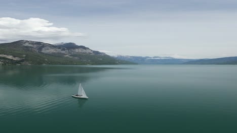 sailing boat on lake water, walensee glarus, weesen walenstadt, switzerland- backward shot