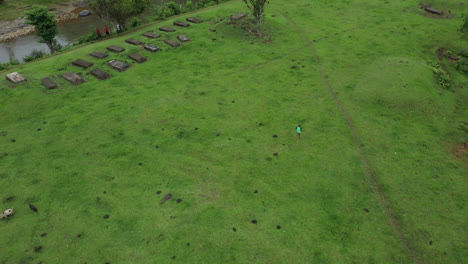 a-boy-running-across-the-green-lawn