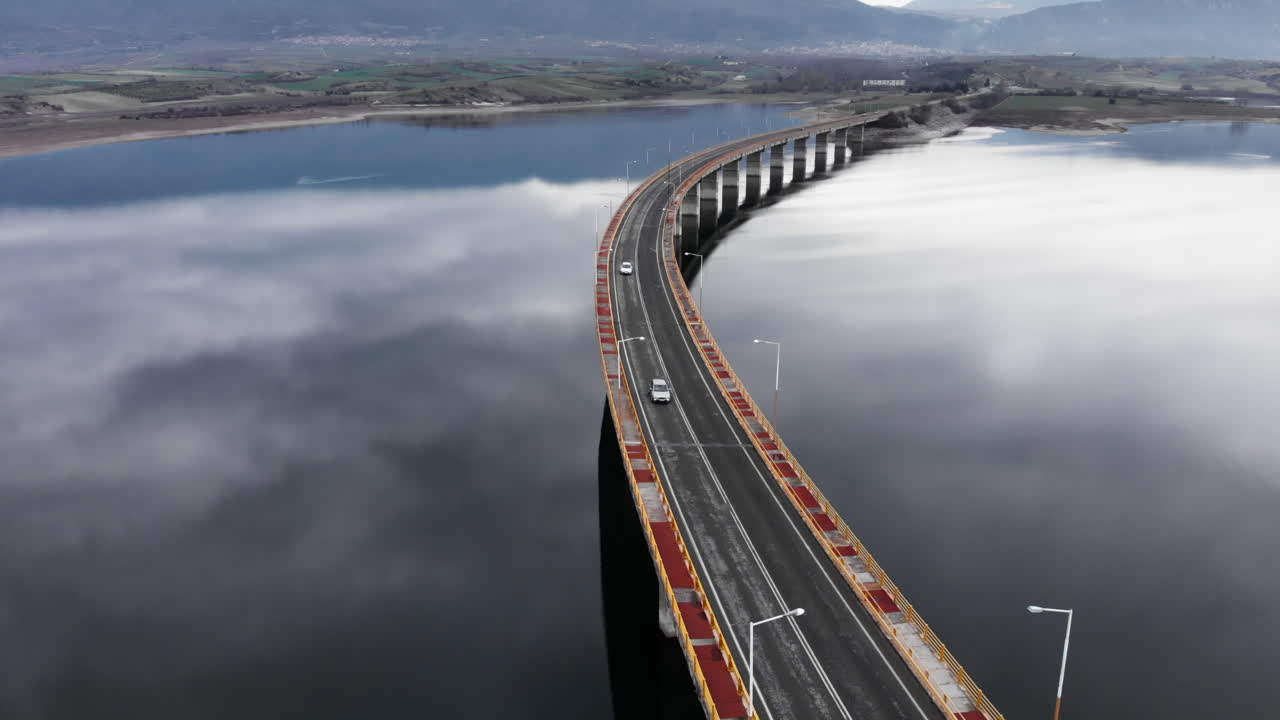 Cars on Servia High Bridge Captured by Drone Over Cloudy Lake