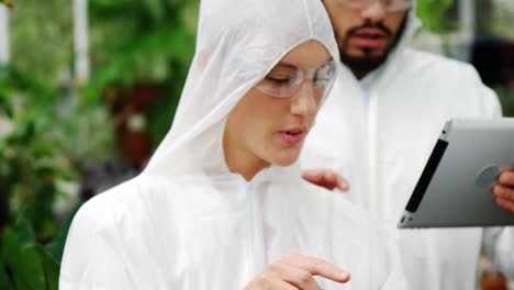 Men-and-woman-looking-at-digital-tablet