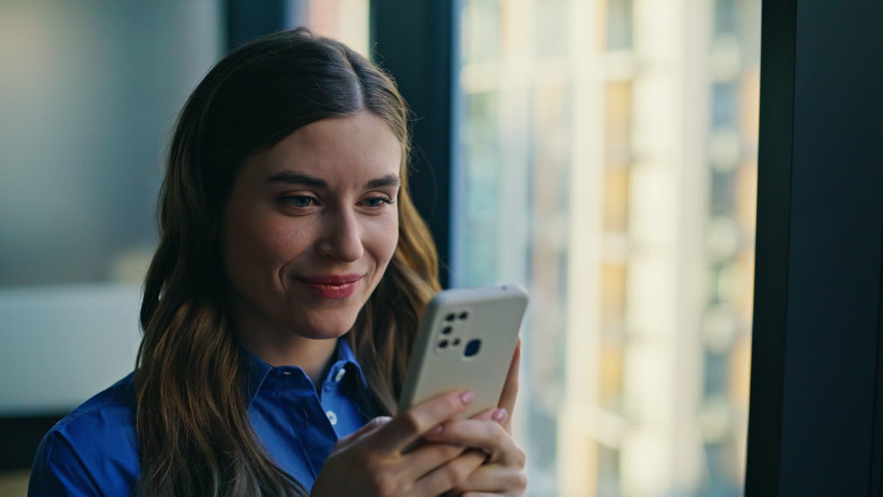 Smiling woman internet order in smartphone at apartment closeup. Happy lady