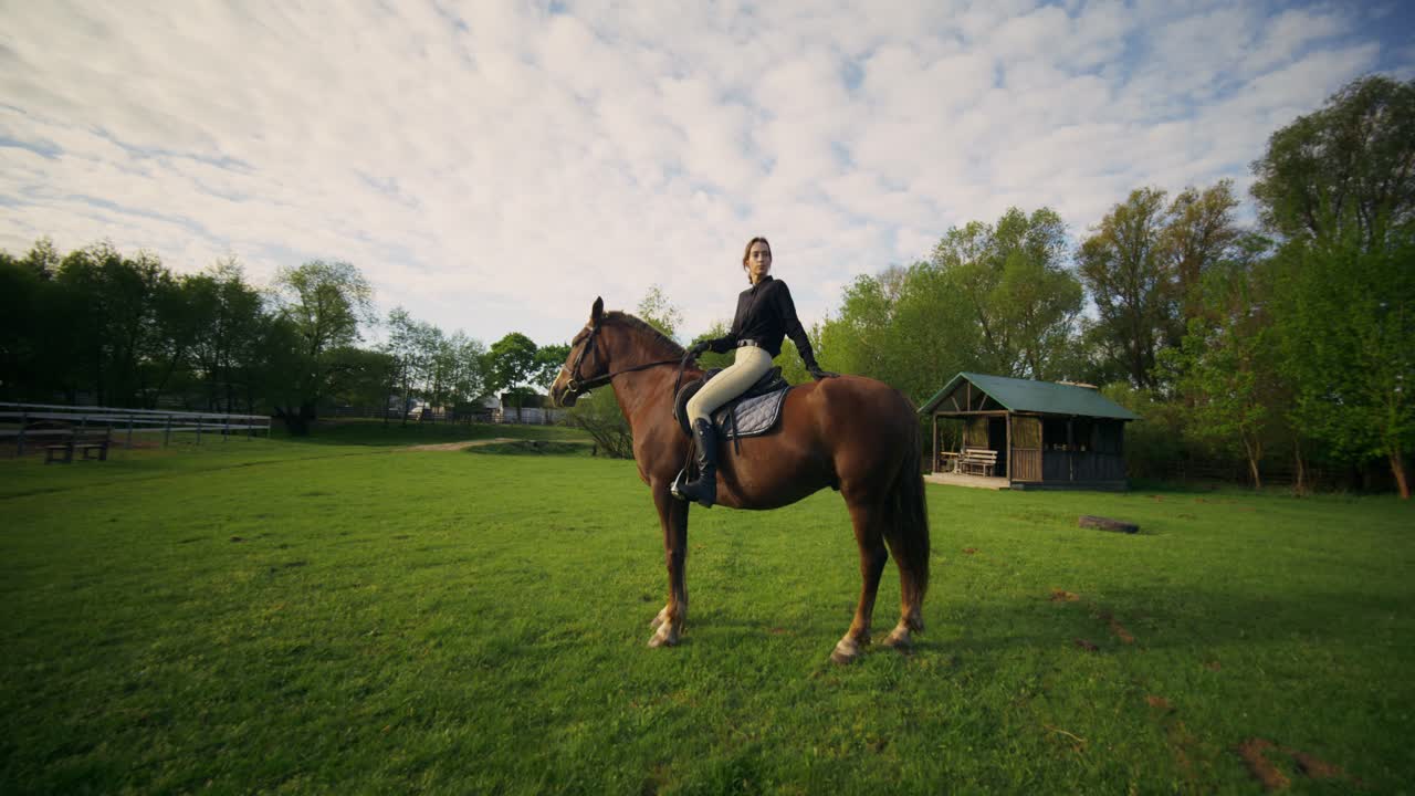 Woman Horseback Riding in a Countryside Setting