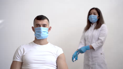 male patient waits for injection