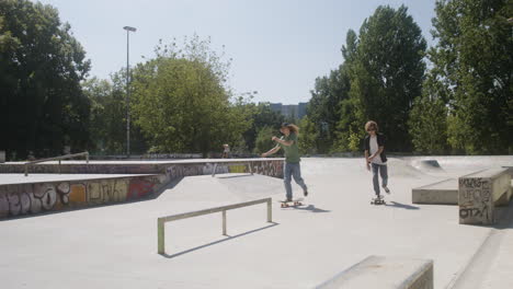 caucasian friends in skatepark.