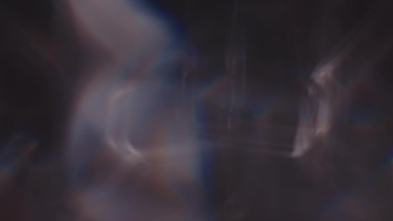 Multicolored light leaks 4k footage on black background lens studio flare leak burst overlays