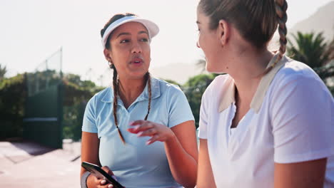tennis players chatting on the court