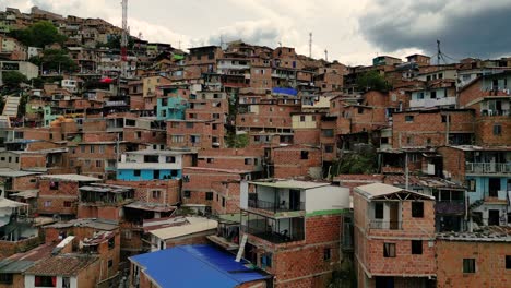 epic shot over the comuna 13 neighborhood in medellin on a cloudy afternoon