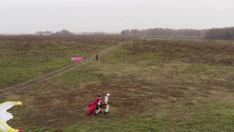 paragliding tandem flight in a field